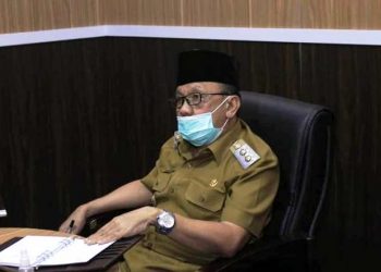Wakil Bupati Lahat Haryanto saat mengikuti Rakor Percepatan Realisasi APBD Tahun 2021, Selasa (25/5/2021). (fornews.co/kominfo lahat)